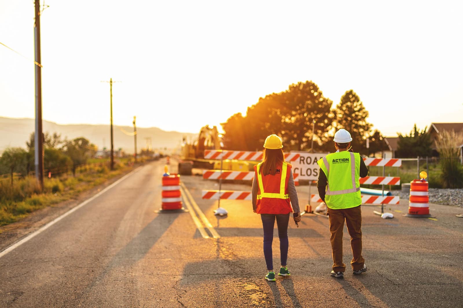 Traffic control crew at golden hour